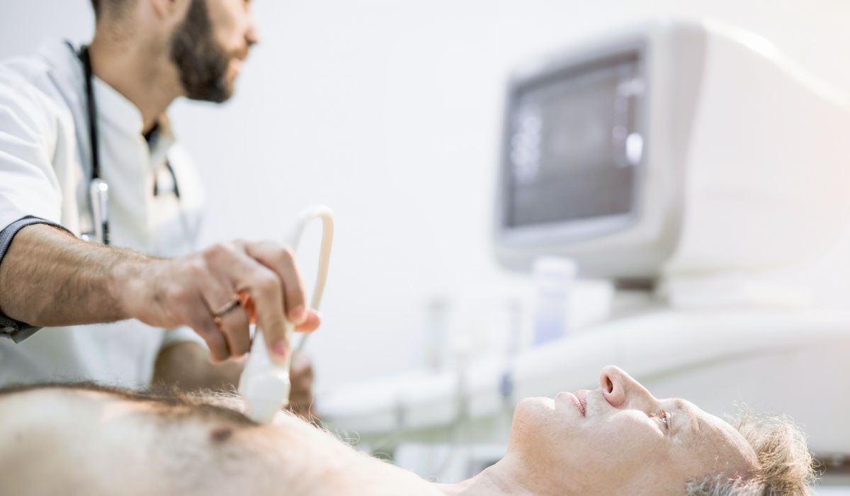 Echocardiography student performing a cardiac ultrasound scan